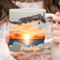 Custom quote on sunset ceramic cup. Warm orange sky coffee mug detail. Close up of personalized ocean sunset mug, held by a woman.